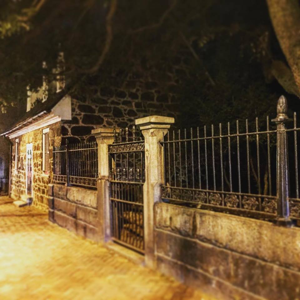 Exterior of the Poe Museum in Richmond’s Shockoe Bottom neighborhood at night.